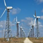 a road with windmills on either side of it